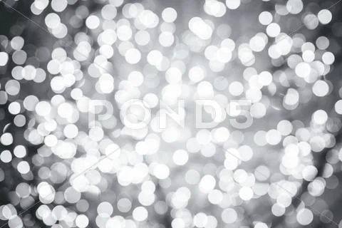 Silver background with natural bokeh defocused sparkling lights Stock Photos