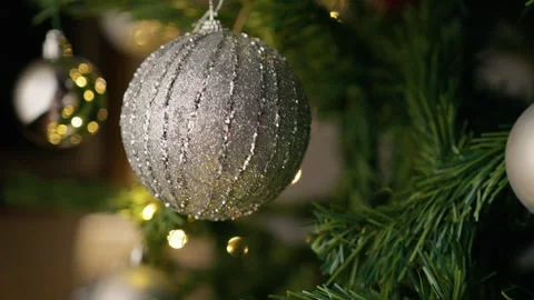 Silver ball on the branches of a christmas tree Stock Footage 254768998