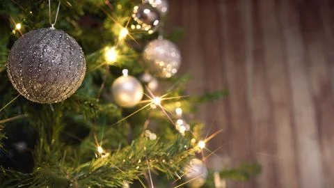 Silver ball hanging on a Christmas tree Stock Photos