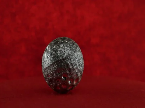 Silver ball on red background Stock Footage 70348190