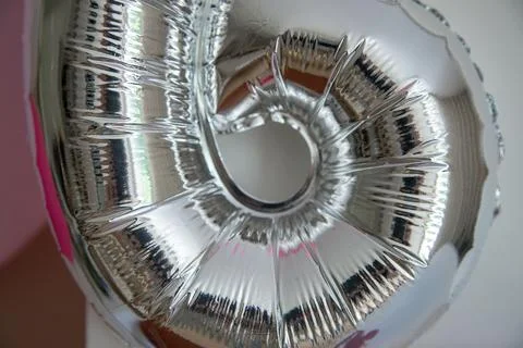 Silver balloon close-up with abstract reflections and soft texture Stock Photos