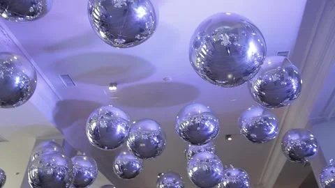 Silver balls on the ceiling shimmer from blue lamps in the restaurant on the Stock Footage 193019058