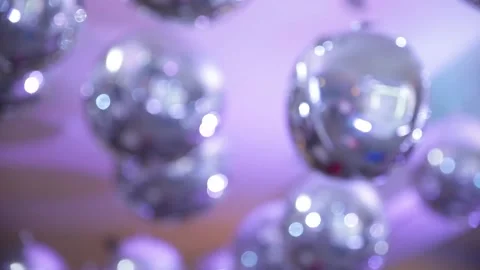 Silver balls on the ceiling shimmer from blue lamps in the restaurant on the Stock Footage 193019498
