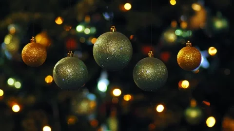 Silver balls in the foreground shiny rotate against the background of glowing ch Stock Footage 254905914