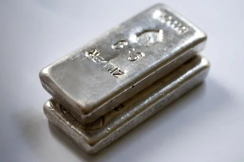 Silver bars of 1 kilo each isolated at at grey colored background Stock Photos