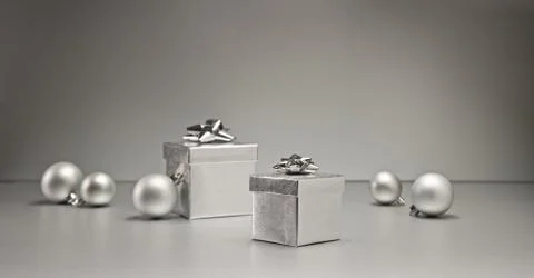 Silver bauble and present Stock Photos