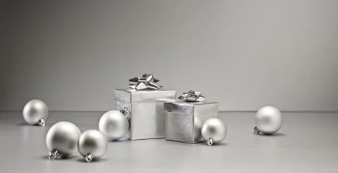 Silver bauble and present Stock Photos