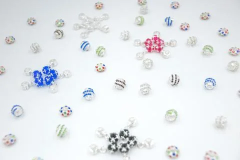 Silver beads of different shape with crystals of blue, green, red, pink, purp Stock Photos