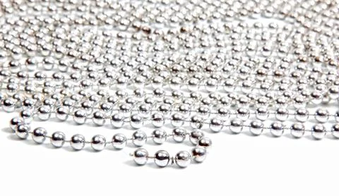 Silver beads on white background Stock Photos