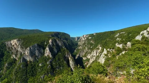 Silver binoculars frame a deep canyon. Lazar's Canyon, Serbia Stock Footage 345329740