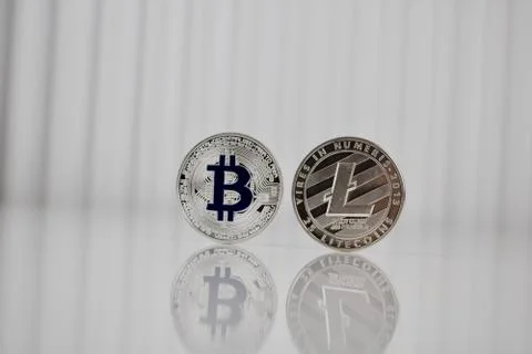 Silver bitcoin and litecoin Stock Photos