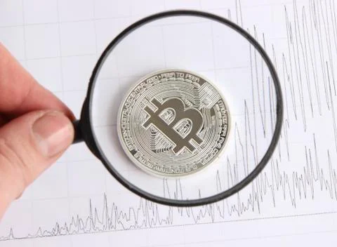 Silver bitcoin on the background graphics Stock Photos