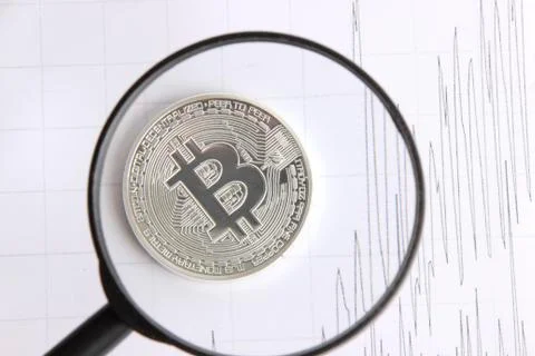 Silver bitcoin on the background graphics Stock Photos