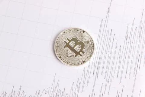 Silver bitcoin on the background graphics Stock Photos