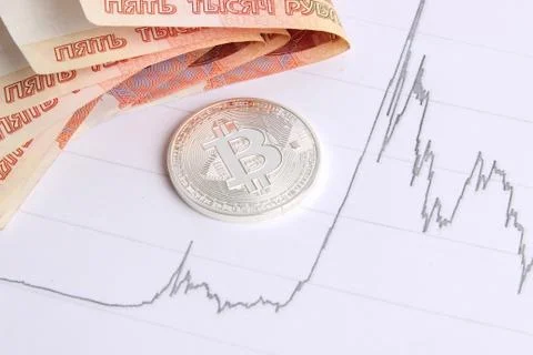 Silver bitcoin on the background graphics Stock Photos