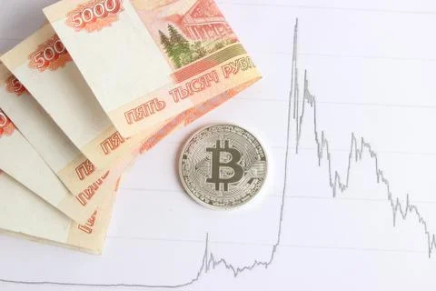 Silver bitcoin on the background graphics Stock Photos