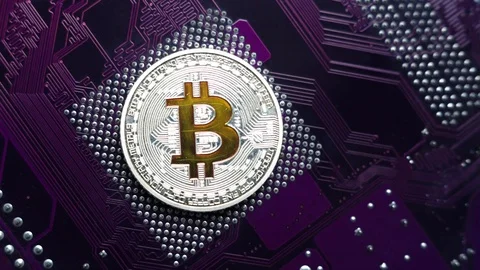 Silver bitcoin close-up on a purple microchip background. Stock-Footage 90433506