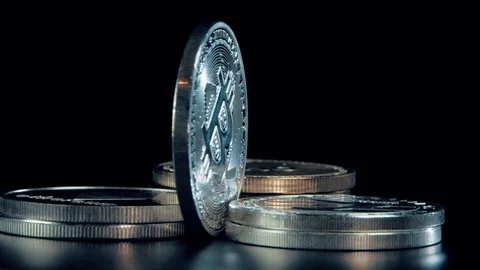 SIlver Bitcoin coin on black background. Silver Crypto coin on spinning stand. 스톡 동영상 126904927