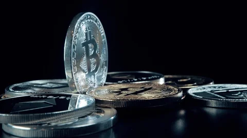 SIlver Bitcoin coin on black background. Silver Crypto coin on spinning stand. 스톡 동영상 126908900