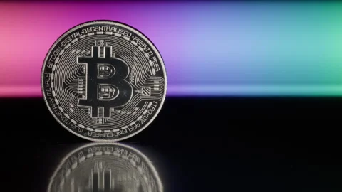 Silver Bitcoin On A Rainbow Background With Copy Space Stock Footage 273589580