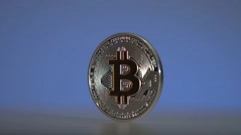 Silver Bitcoin rotate on the white surface with amazing blue gradient background Stock Footage 132318007