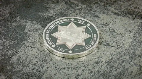 Silver bitcoin on a table with a stone texture. Close view Stock Footage 79089000