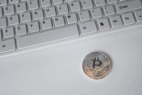 Silver bitcoin on the table. Symbol of crypto currency. Virtual currency. BTC. Stock Photos