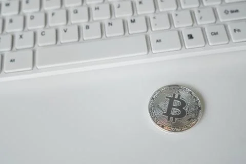 Silver bitcoin on the table. Symbol of crypto currency. Virtual currency. BTC. Stock Photos