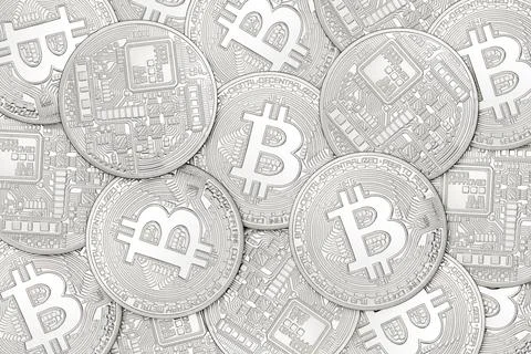 Silver bitcoins background Stock Photos