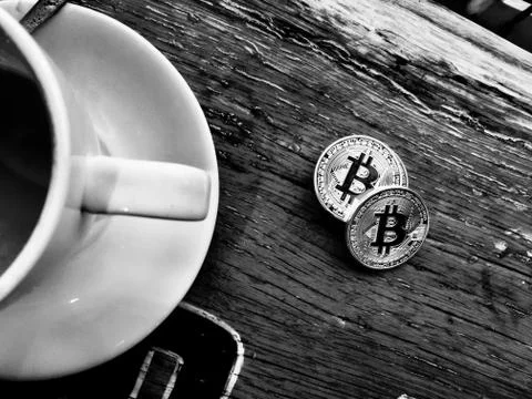 Silver bitcoins on table Stock Photos