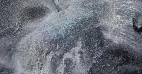 Silver black fluid liquid background close-up. Natural silver particles sparkle Stock Footage 196702900