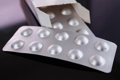 Silver blister pack of small pills Stock Photos