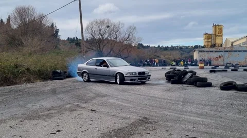 Silver BMW E36 Coupe Drifting on Racetrack with Tire Smoke, Motorsport Event Stock Footage 326992968