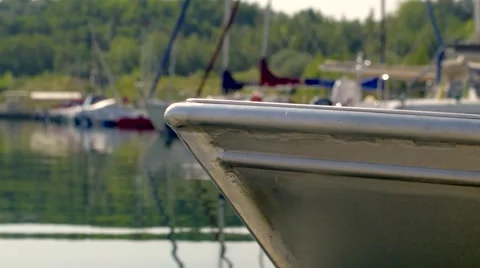 Silver Boat on light Waves is lying in Port 動画素材 40400380