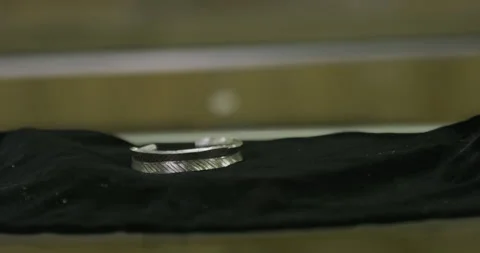 Silver bracelets on black table surface, move in Stock Footage 141359714