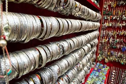 Silver bracelets on display in a souk 写真素材