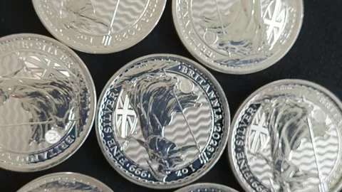 Silver Britannia coins rotating Stock Footage 244925031