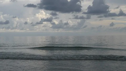 Silver Calm Sea with small Waves and cloudy sky Stock Footage 94026141