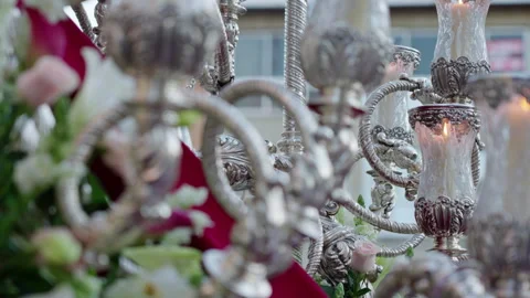 Silver candelabra with lit candles during Holy Week procession Stock Footage 333915935