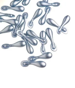 Silver capsule with a cream for face Stock Photos