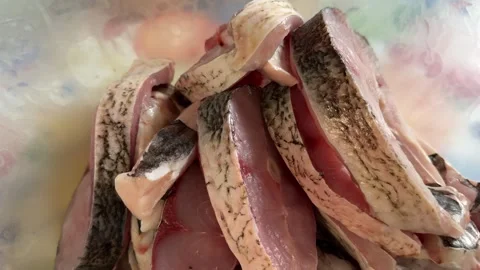 Silver carp fish Cooking Indoors pan grilled seasoned Cod fillets on Stovetop Stock Footage 318443348