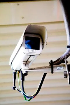 Silver CCTV Camera. Protection security system watching people Stock Photos