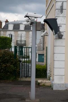 Silver CCTV Camera. Protection security system watching people Stock Photos