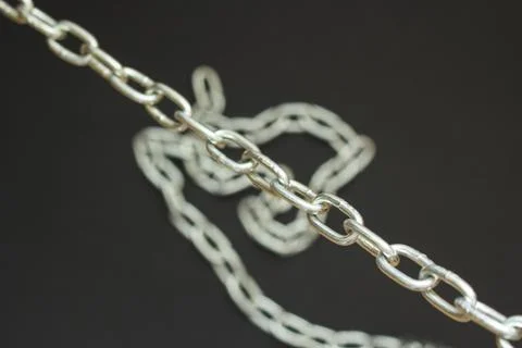Silver chain on black background, concept strong love Stock-Fotos