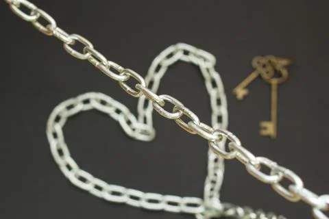 Silver chain on black background, concept strong love Stock Photos