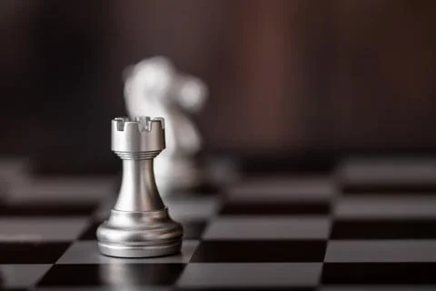 Silver chess on the board Stock Photos