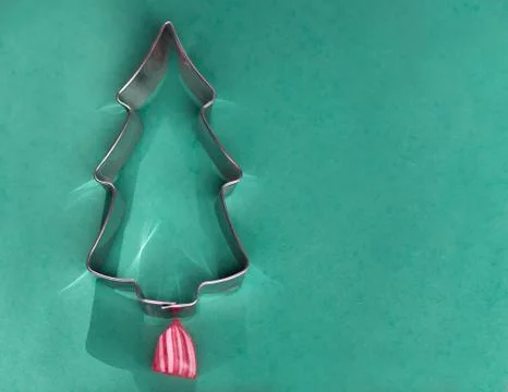 Silver Christmas tree with a red and white candy and bright reflections Stock Photos