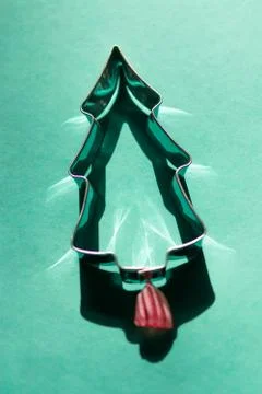Silver Christmas tree with a red and white candy and bright reflections Stock Photos