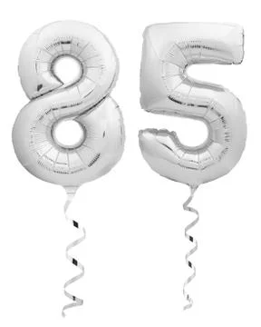 Silver chrome number eighty five 85 made of inflatable balloon with ribbon on Stock Photos