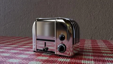 A silver chrome toaster on top a table with red and whit red and table cloth Stock Photos